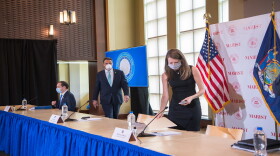 Gov. Andrew Cuomo, with chief of staff Melissa DeRosa, right, and Health Commissioner Dr. Howard Zucker, left, enter the briefing held Friday at Marist College in Poughkeepsie.