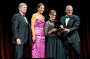 From left to right: Retired Maj. Gen. John L. Barry presents John D. Odegard's National Aviation Hall of Fame award to members of Odegard's family; daughter Stephanie Odegard LaDue, wife Diane Odegard and son John Odegard Jr.