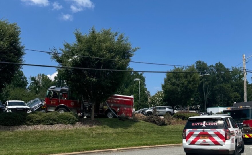 A photo of a High Point Fire Truck that struck multiple unoccupied vehicles while driving off the road.