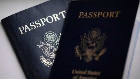 FILE - U.S. passports are arranged for a photograph in Tigard, Ore., Dec. 11, 2021. (AP Photo/Jenny Kane, File)