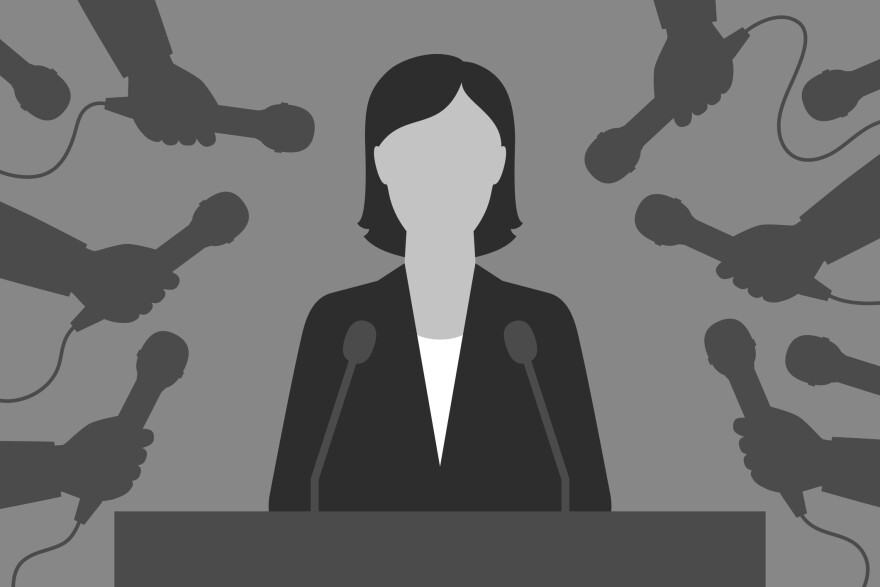 An illustration of a woman behind a podium with hands holding microphones all around her. 