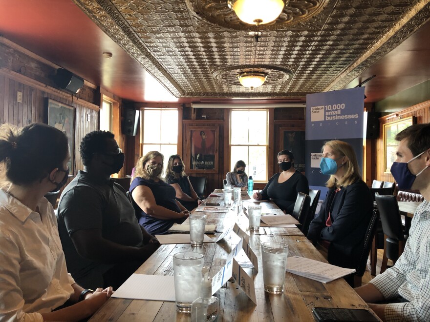 Khari Parker (second from left) talks about the challenges his business is going through with other local restaurant owners and Delegate Brooke Lierman (second from right) Credit: Sarah Y. Kim/WYPR