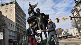 Edred Utomi, left, who plays Alexander Hamilton, with costar Paul Oakley Stovall, who portrays George Washington, in front of the city of Hamilton's 'The American Cape' statue on High Street. 