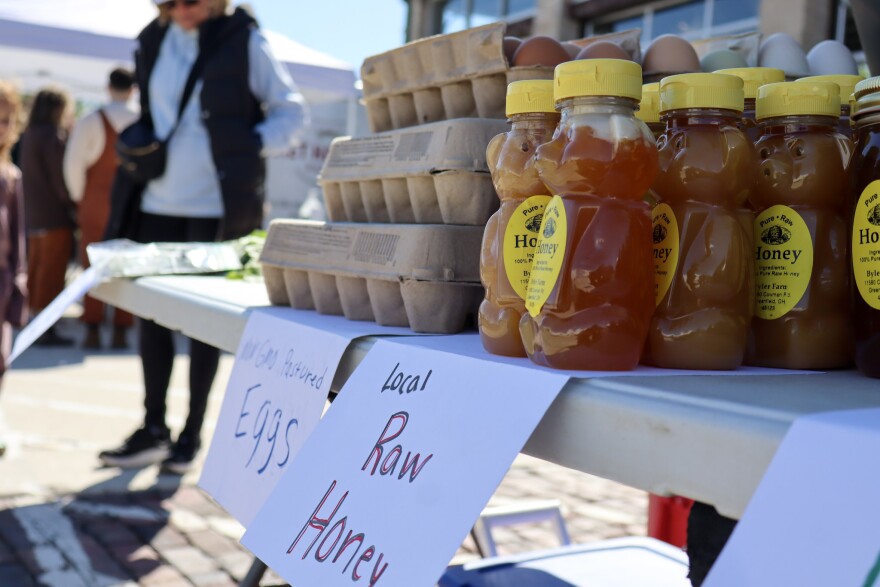 raw honey and eggs sit on a table at 2nd Street Market outdoor farmers market opening weekend and MayFair Plant Sale