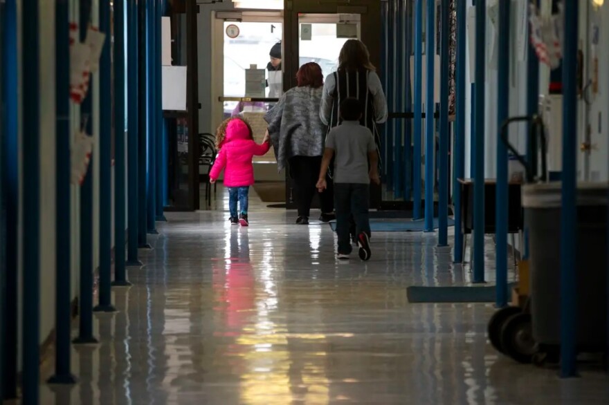 Students and teachers walk through the halls at Cactus Elementary School.