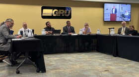 GRU Authority board members listen during the general public comment portion of the meeting on Wednesday, Oct 14, 2026. (Rachel Hunter/WUFT News)