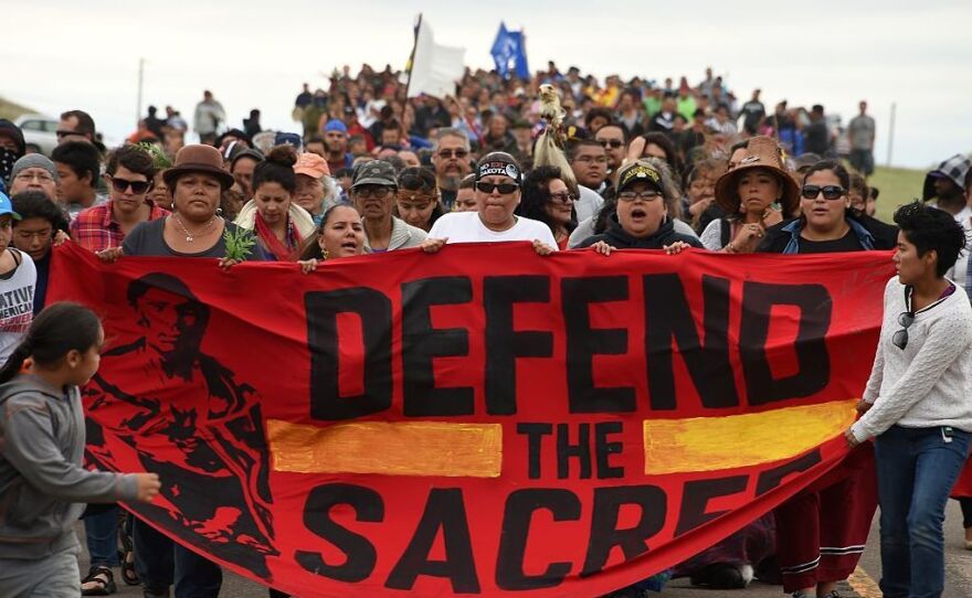 The Standing Rock Sioux Tribe says the planned pipeline could contaminate its drinking water and sacred lands.