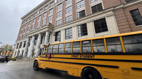A school bus passes in front of the Alaska State Capitol on Wednesday, May 20, 2026.