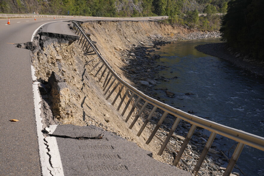 FILE - Damage from Hurricane Helene flooding is seen along eastbound lanes of Interstate 40 near the North Carolina state line, Oct. 7, 2024, in Cocke County, Tenn.