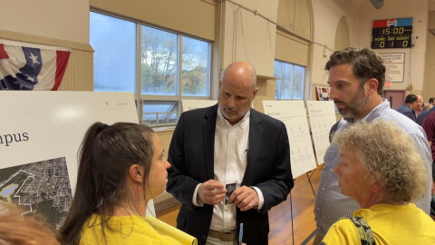 Archbald resident and cofounder of Stop Archbald Data Centers Tamara Misewicz-Healey, left, questions Erik Draaisma, executive vice president of business development for Corscale, during an open house for the Project Gravity Data Center Campus.