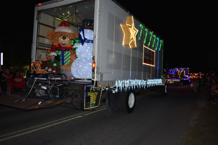 A central part of the festival is a parade where local businesses deck out their trucks and trailers in full Christmas regalia and pass out candy and holiday cheer to people lining the street. 