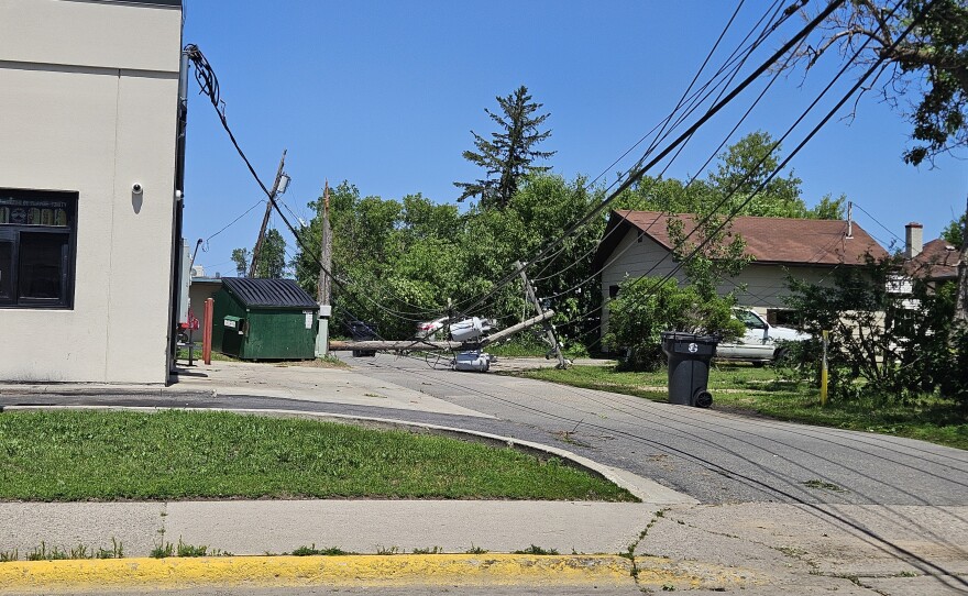 A broken power line drapes across an alley in the aftermath of the straight-line wind storm in Bemidji on June 21, 2025.