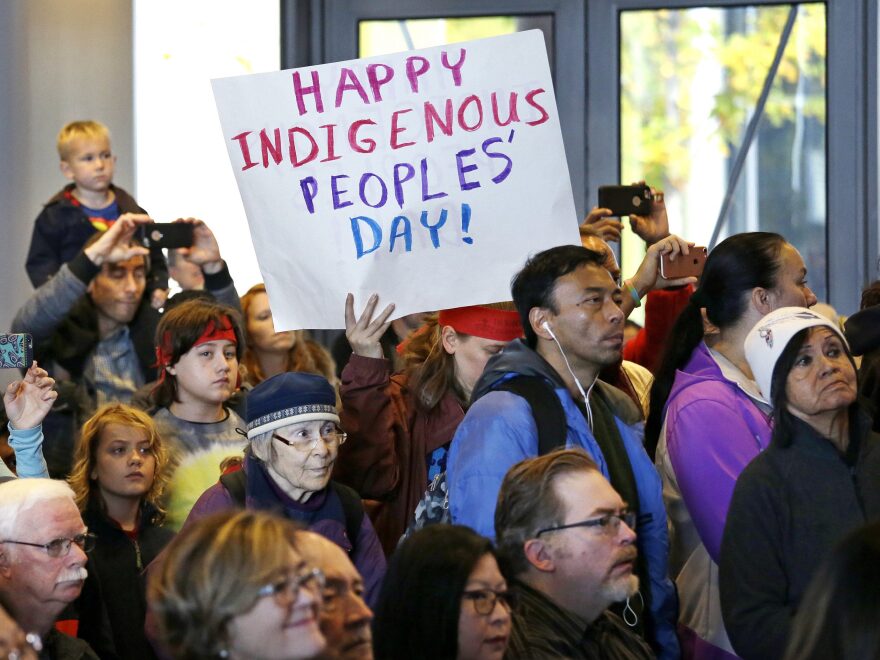 People look on at a celebration of Indigenous Peoples' Day in 2016 at Seattle's City Hall. Seattle began observing Indigenous Peoples' Day two years earlier to promote the well-being and growth of Seattle's Indigenous community.