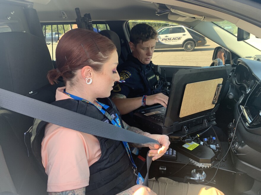 Grand Mental Health specialist Tessa Mitchell, left, buckles up for her shift with Broken Arrow Police Officer Tiffany Yarborough on Sept. 4, 2024, at Broken Arrow's police station.