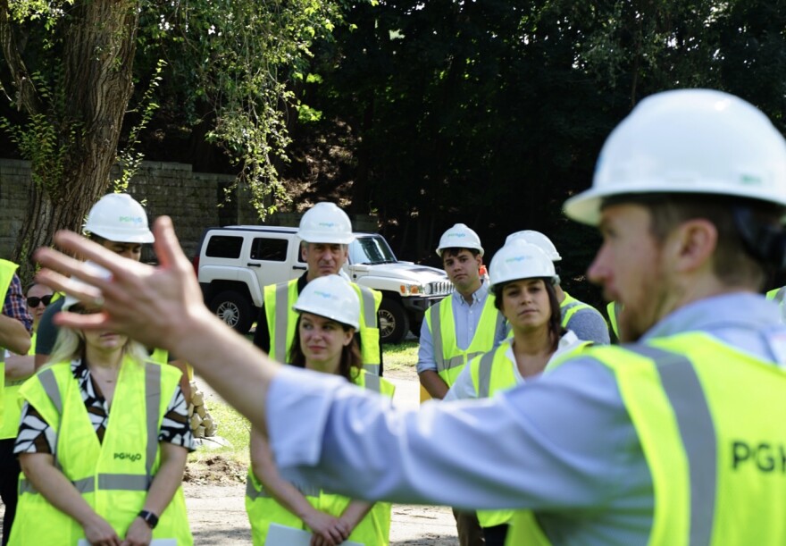 State Rep. Sara Innamorato (second from right) and other state and local leaders listen to PWSA CEO Will Pickering talk about new infrastructure planned at the Highland Park reservoir.