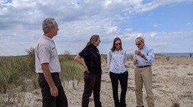 Carper and U.S. FWS principal deputy director Martha Williams (Center left) discuss the benefits of green infrastructure