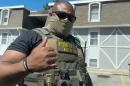 An ICE agent outside an Olathe apartment complex on July 11.