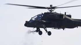 A South Korean army AH-64 Apache helicopter fires during a joint drill between South Korea and the United States at Rodriguez Live Fire Complex in Pocheon, South Korea, Tuesday, Nov. 14, 2023. (AP Photo/Lee Jin-man)