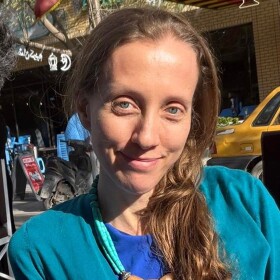 U.S. journalist Shelly Kittleson poses for a cellphone photo in a cafe in Baghdad, Iraq, Monday, March 30, 2026.