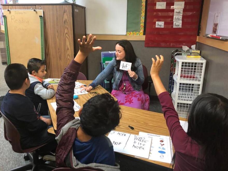 Brittany Beaumont, a literacy specialist at Hazel Valley Elementary in Burien, leads a small group of second-graders in phonics instruction.