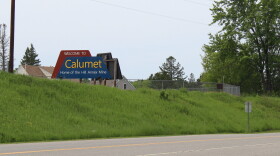 A sign off Highway 169 reads, "Welcome to Calumet Home of the Hill Annex Mine" on June 17, 2024.