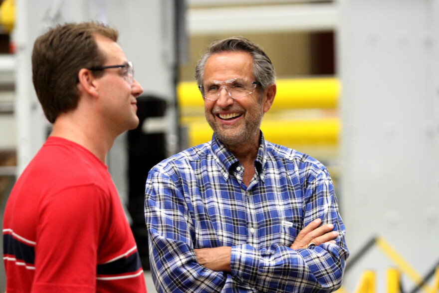 CEO Bob Chapman, right, talks to an employee at a Barry-Wehmiller factory.
