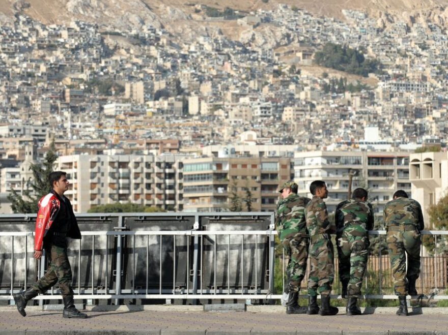 While fighting continues in Syria, the government has been detaining many nonviolent activists, according to monitoring groups. Here, Syrian soldiers are shown on a bridge in Damascus last November.