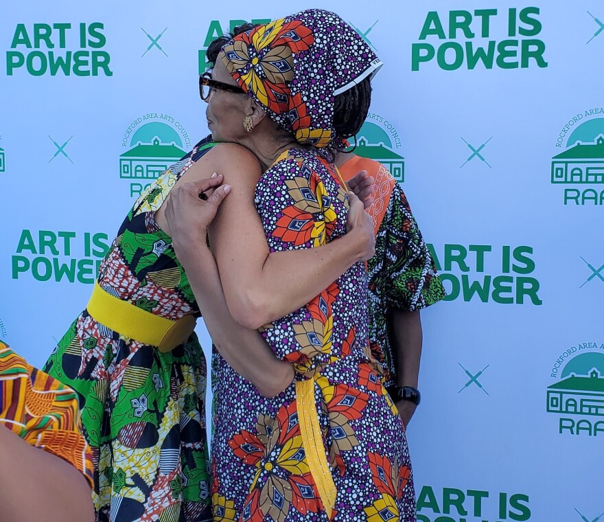 Mary McNamara Bernsten and Cleta Berryhill taking a moment to embrace.