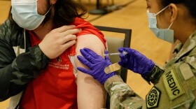 A COVID-19 vaccine is administered at Illinois State University during a recent clinic.