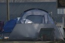 A photo of a tent set up in Bloomington's Seminary Park.