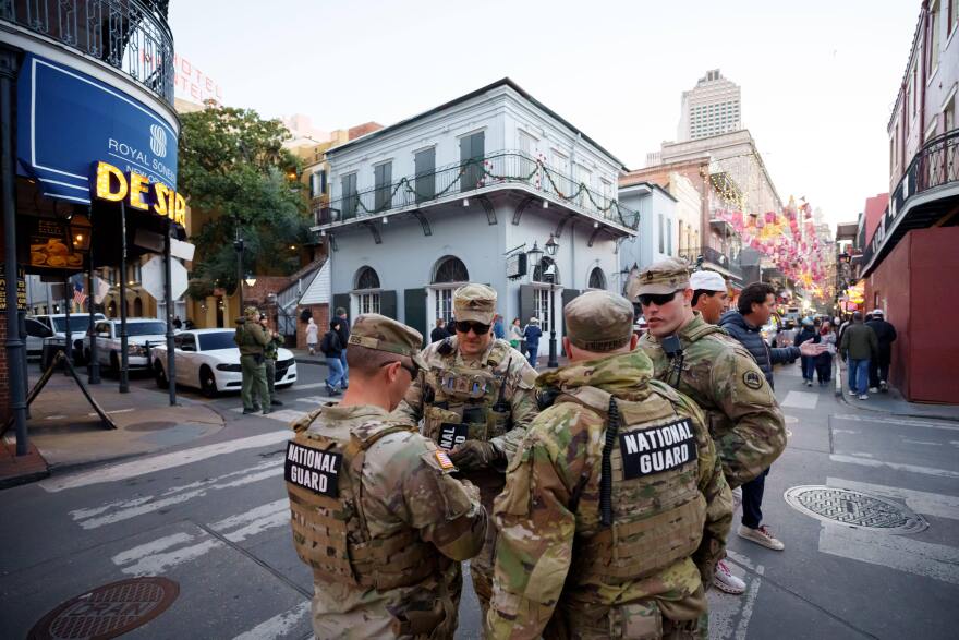 Louisiana National Guard members patrol the French Quarter along Bourbon Street and intersecting streets as part of their deployment for New Year's celebrations in New Orleans, Tuesday, Dec. 30, 2025. (AP Photo/Matthew Hinton)