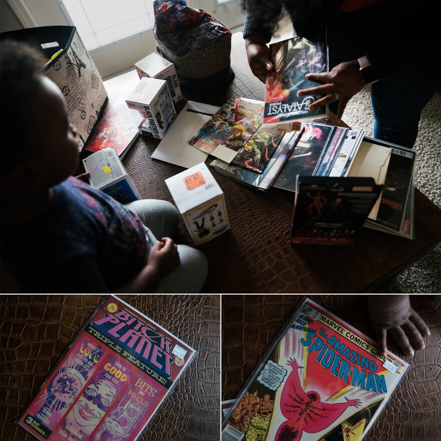 (Top) Williams and her son look at comic books spread out on the coffee table. (Bottom) Two of Williams' favorites, an anthology that highlights writers of color and an <em>Amazing Spider-Man</em> issue where character Monica Rambeau, one of Williams' favorites, made her first appearance.