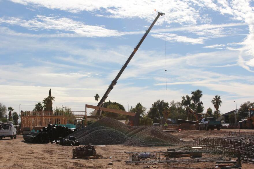 construction equipment parked on large dirt lot
