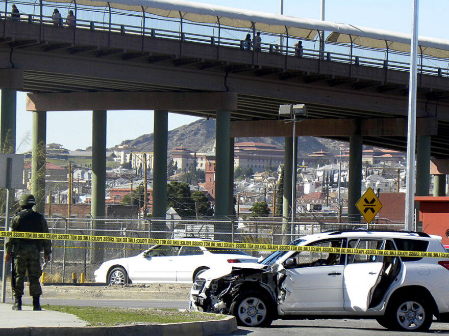A Mexican soldier patrols the scene where three U.S. consulate staffers were killed Saturday in Ciudad Juarez, across from El Paso, Texas.