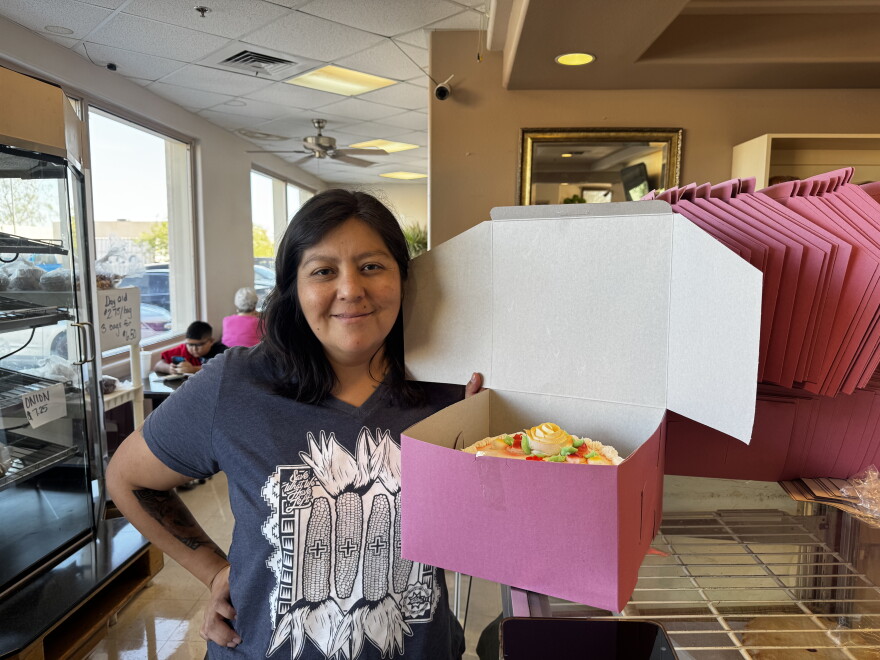 Theresa Jackson, a Yuma native, picks up a birthday cake for her granddaughter's first birthday.