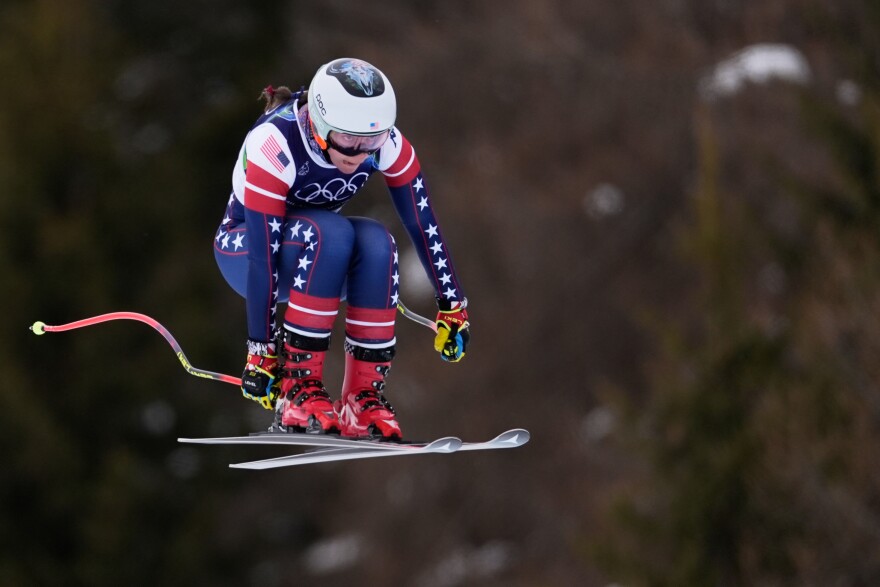 United States' Breezy Johnson speeds down the course during an alpine ski women's downhill training, at the 2026 Winter Olympics, in Cortina d'Ampezzo, Italy, Saturday, Feb. 7, 2026.