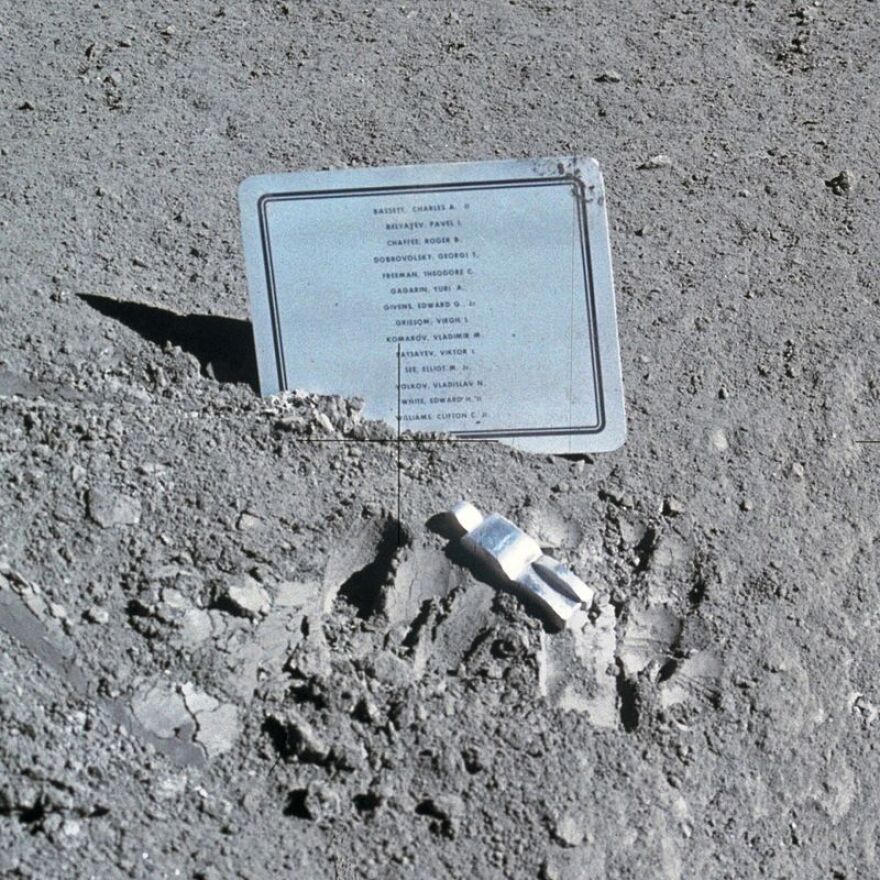 Fallen Astronaut and plaque on lunar surface.