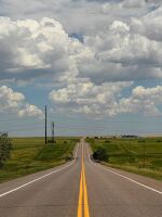 A desolate Highway 36 runs past what is now a ghost town on the eastern plains in Cabin Creek, Colorado.