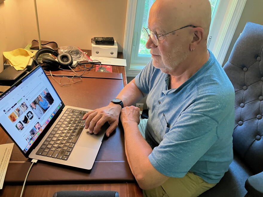 Skip Shea, 66, sits at his desk in Uxbridge, Massachusetts.