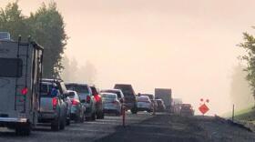 Heavy smoke from the Swan Lake Fire contributes to traffic delays on the Sterling Highway on June 21, 2019. (Photo credit Alaska Division of Forestry)