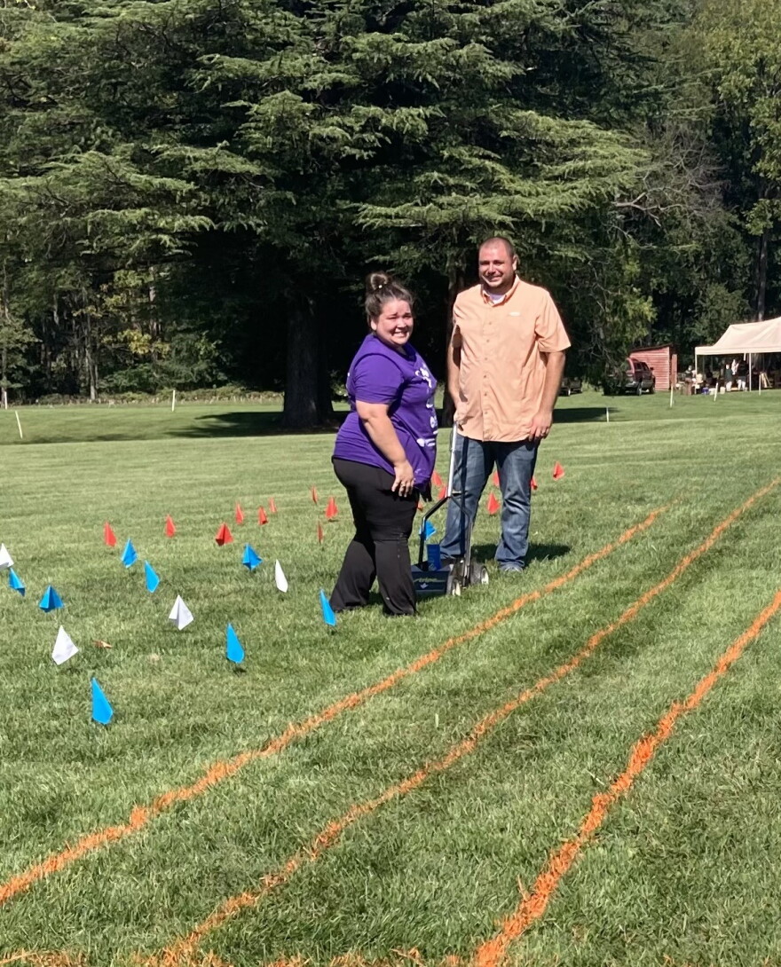 Volunteers create a grid on the lawn at Montpelier to prepare for the creation of a living flag.