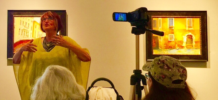 Margaret Coe demonstrates her plein aire kit while painting in the streets of Venice in her Artist Talk at the Karin Clarke Gallery