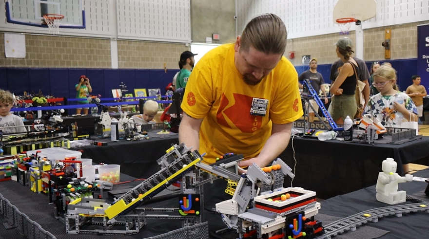 Jeff Johnson with the Rochester LEGO User Group works on a project at the Adams Street R Center. Everyone was invited to play with LEGOs during the Corn Hill Arts Festival.