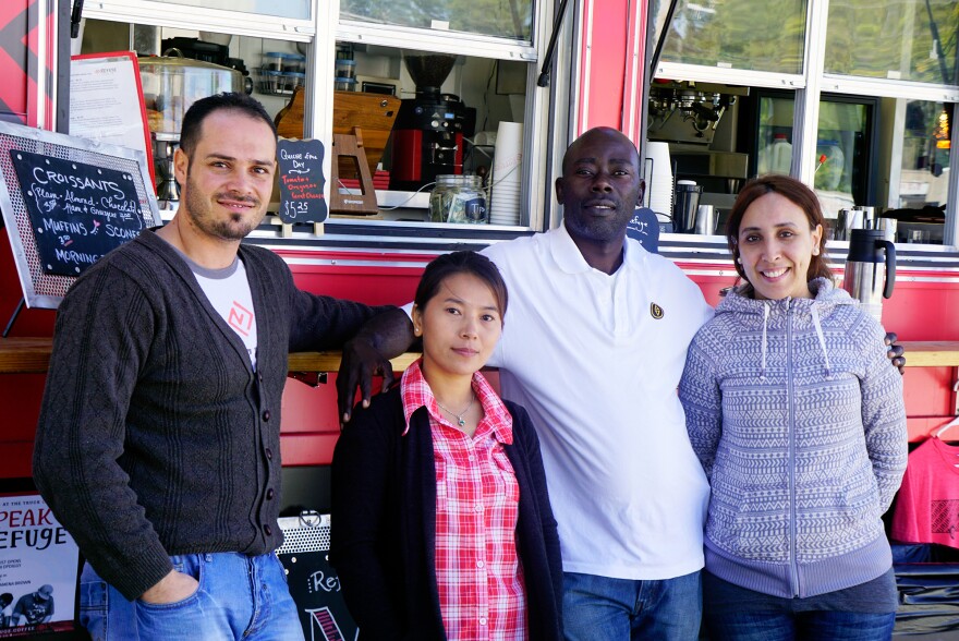 (Left to right) Ahmad Alzoukani, Tha Hlei Iang, Ndahimwa Leon Shombana and Amina Ahyaoui all came to Clarkston, Ga., as resettled refugees and embody the town's international vibe.