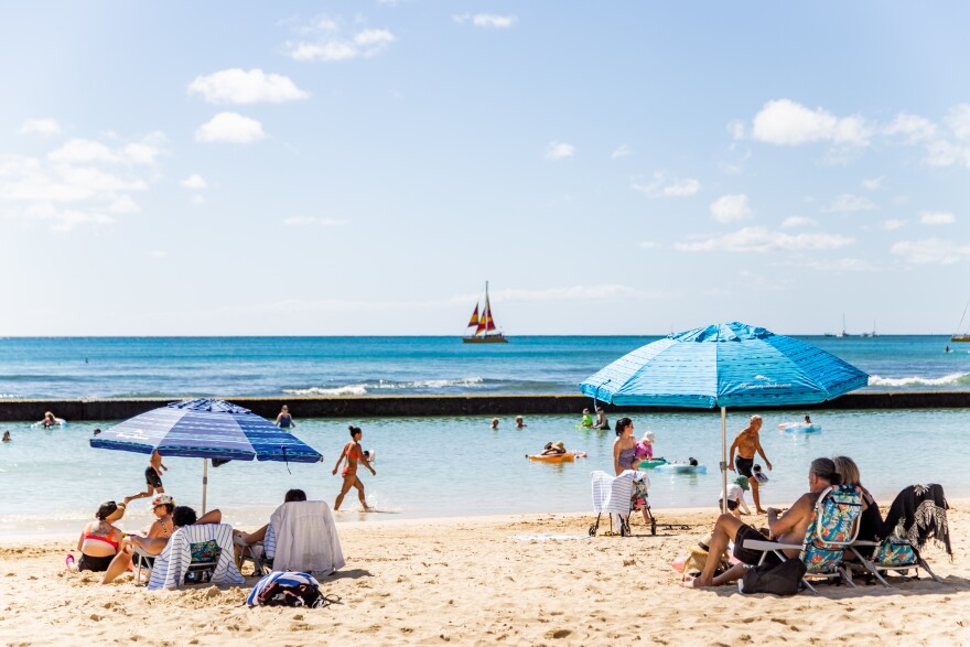 Beachgoers at Kūhiō Beach in Waikīkī. (February 25, 2026)