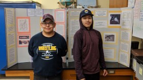 BRHS students Nicholai Chase and Calvin Samson in front of their science fair posters