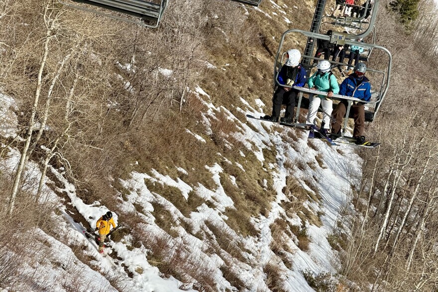 A skier hikes down the Crescent Mine Grade mountain bike trail at Park City Mountain, Feb. 8, 2026.