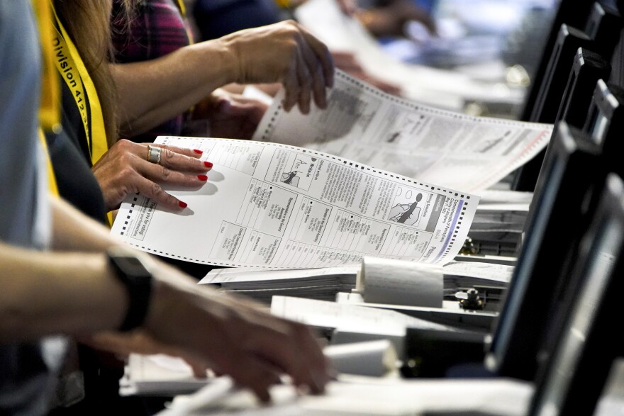 Election workers perform a recount of ballots from the recent Pennsylvania primary election at the Allegheny County Election Division warehouse in Pittsburgh on June 1, 2022.