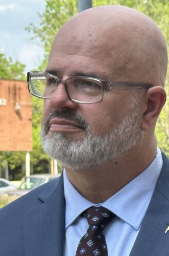 Michael Partain stands outside the Raleigh, N.C. federal courthouse after a 2023 hearing in the Camp Lejeune water case. Partain developed male breast cancer after living on the base. He called the VA's new rule on the disease "a slap in the face to our veteran community."
