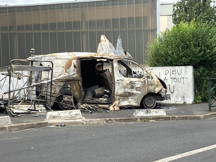 The remains of a burned out vehicle in Nanterre, France.